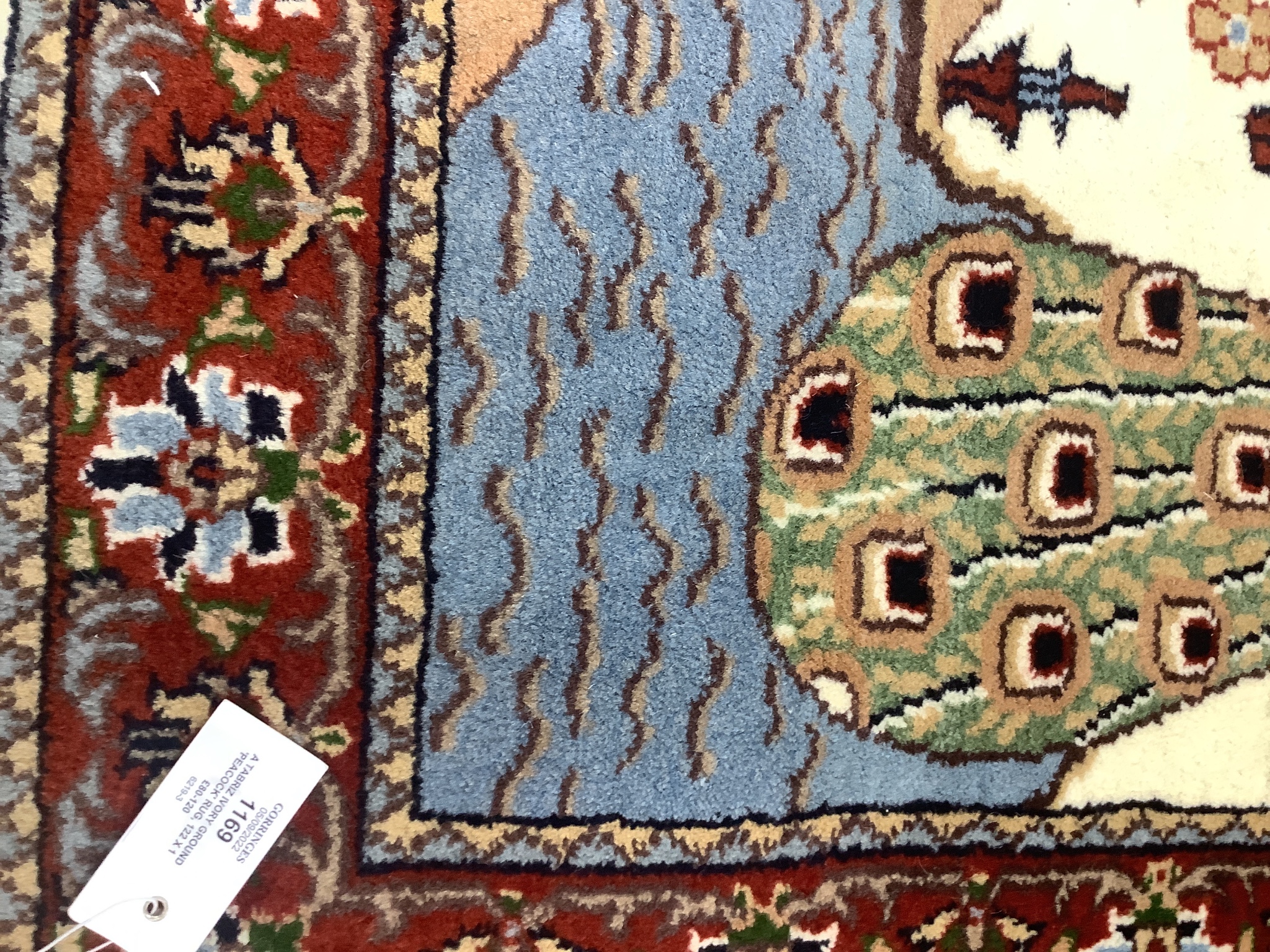 A Tabriz ivory ground 'Peacock' rug, 122 x 120cm